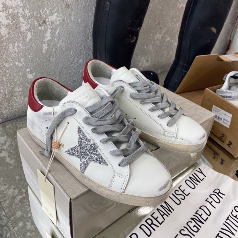 golden goose S*per-star sneakers with sliver glitter and red heel tab
