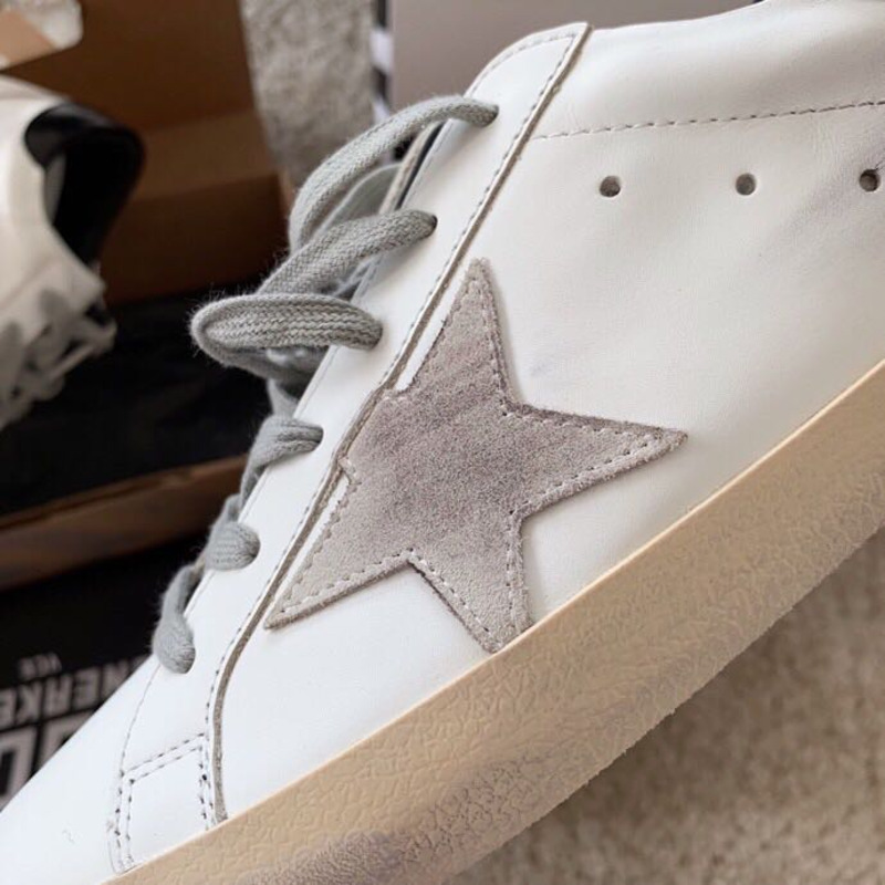 golden goose men’s S*per-star sneakers with suede star and black heel tab