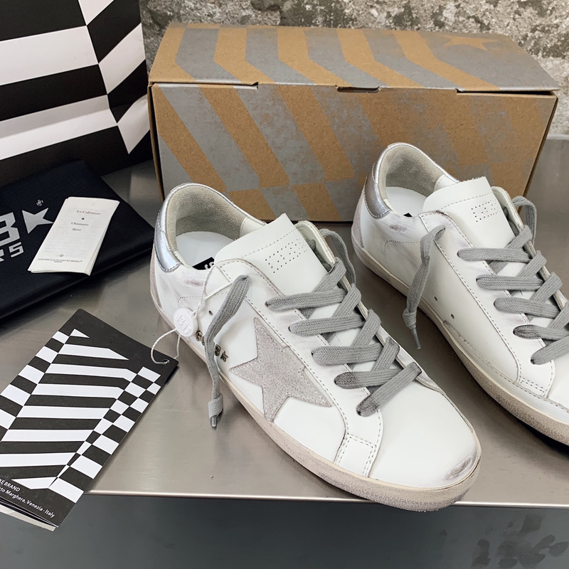 golden goose men’s S*per-star sneakers with suede star and sliver heel tab