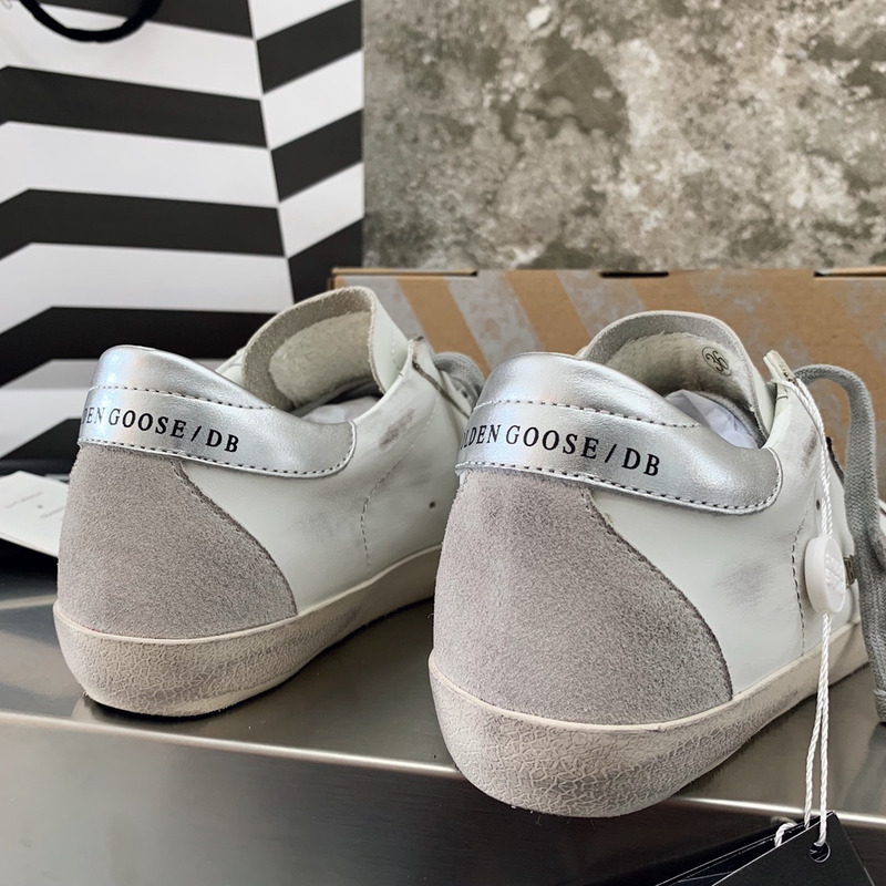 golden goose men’s S*per-star sneakers with suede star and sliver heel tab
