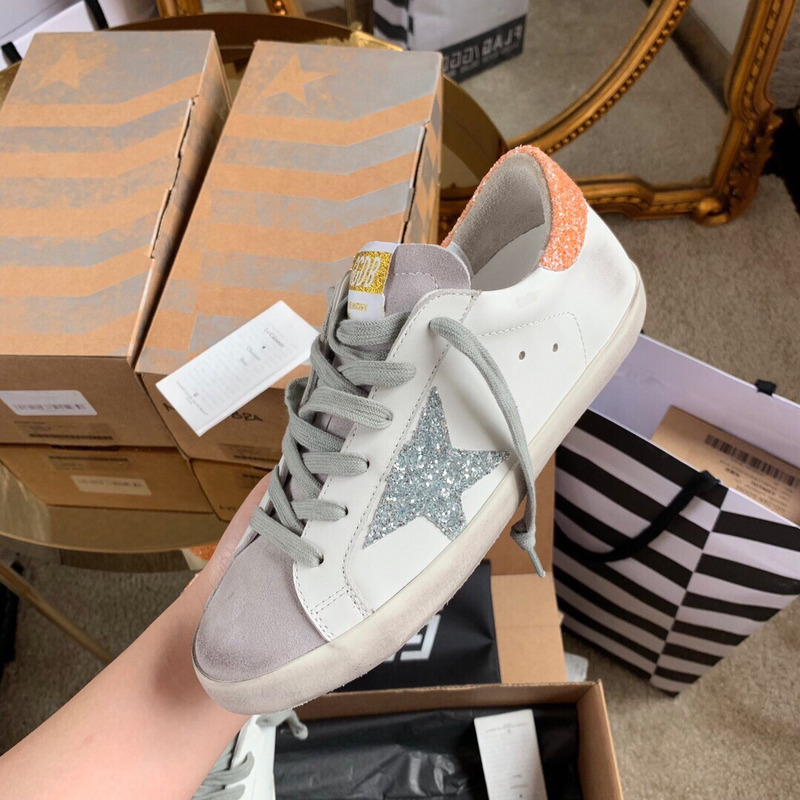 golden goose S*per-star sneakers with sliver glitter and orange heel tab
