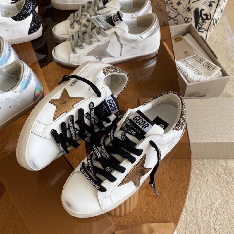 golden goose men’s S*per-star sneakers with brown suede star and glitter heel tab