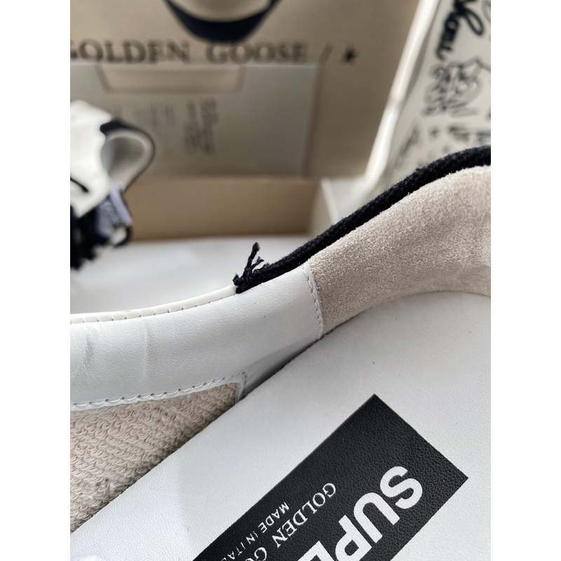 golden goose men’s S*per-star sneakers with black suede star and black heel tab