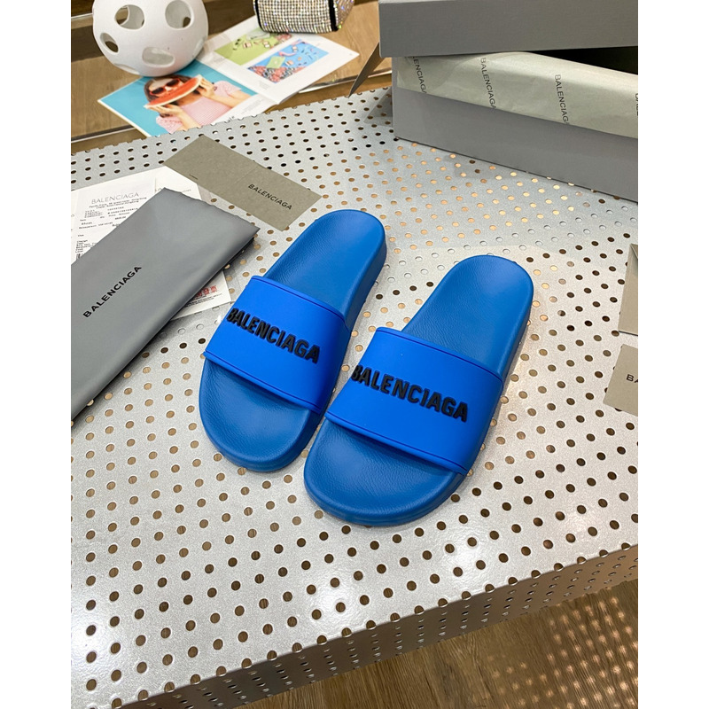 Ba*len*cia*ga pool slide sandal in blue smooth rubber with black 3d Ba*len*cia*ga logo