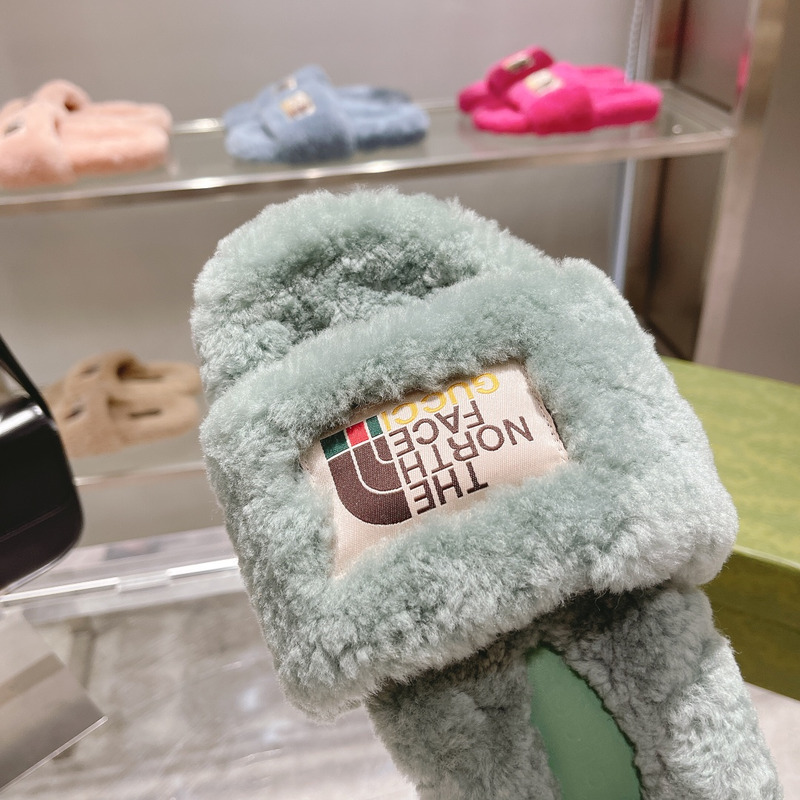 g*u*i x the n0*h F**e shearling slides green