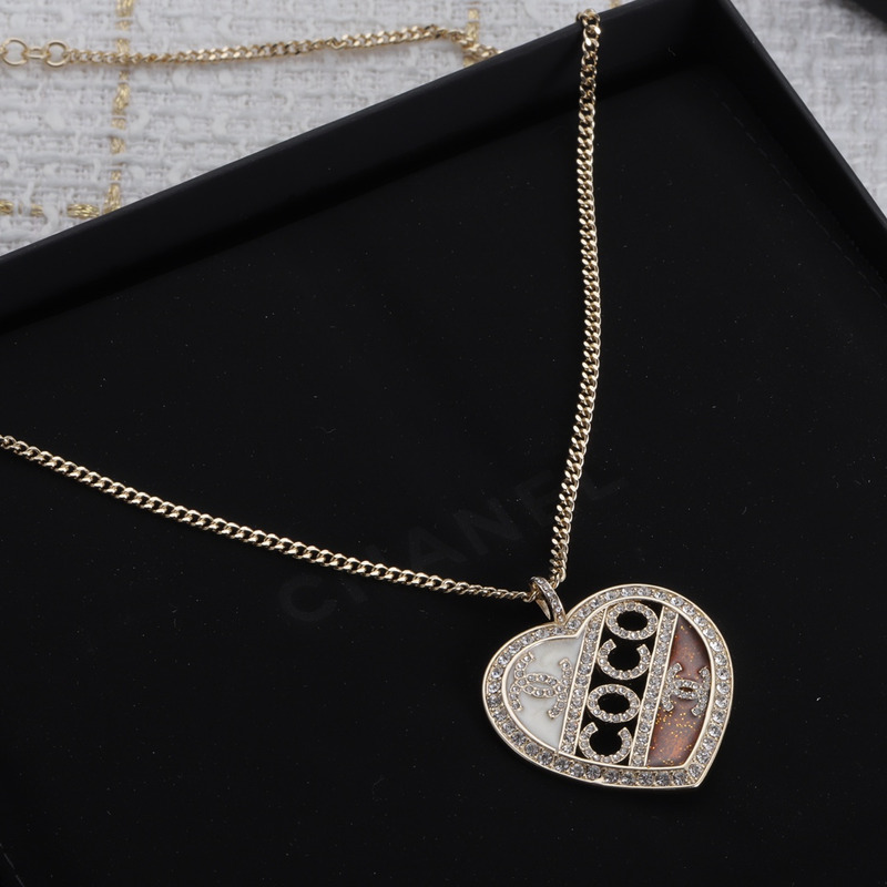 Ch*el pendant metal and crystal necklace