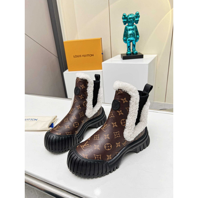 l**is V*t*n ski ruby flat ankle boot monogram