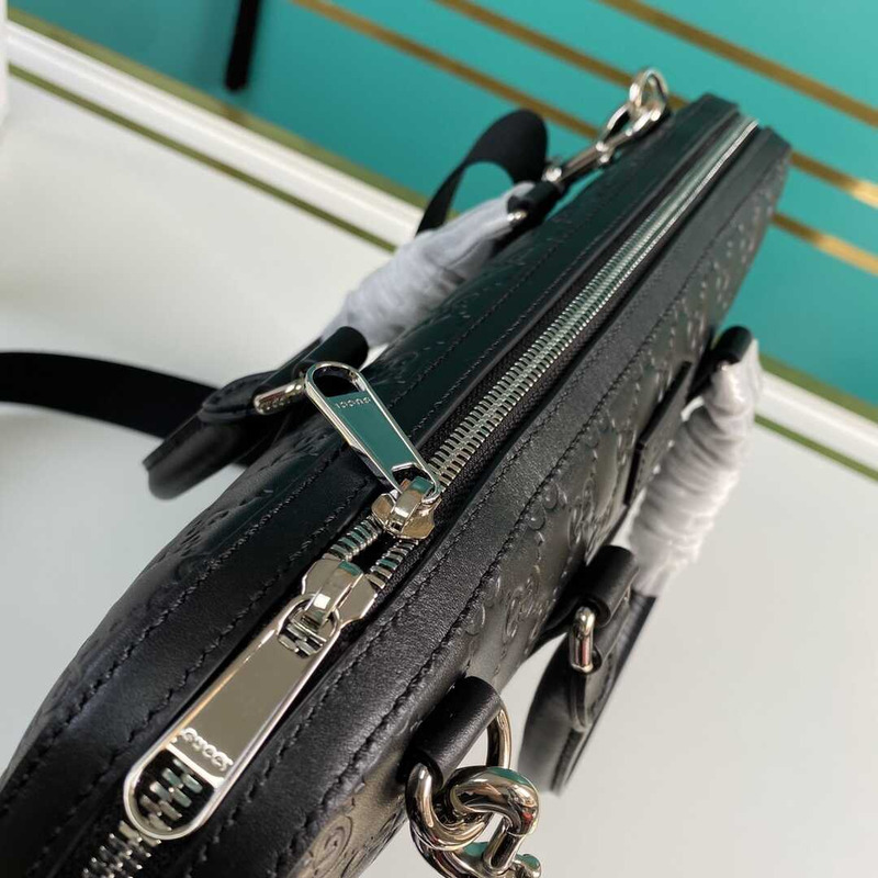 g*u*i gg S*p*e embossed leather briefcase black