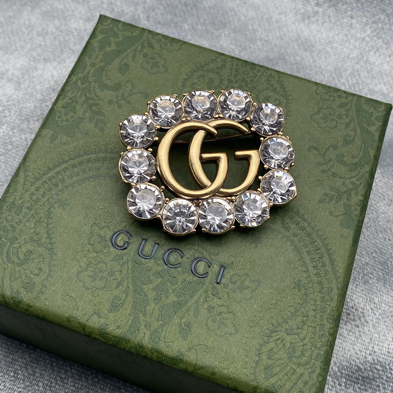 G*u*i metal double g brooch with crystals