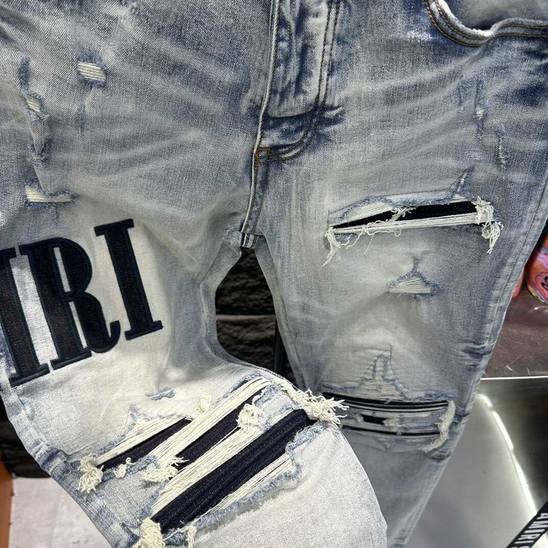 Amiri Logo Distressed Skinny Jeans Blue