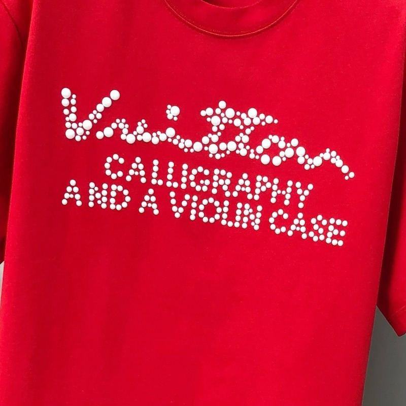 l**is V*t*n t-shirt red calligraphy and a violin case