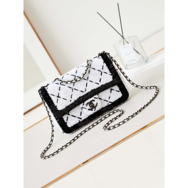 Ch*el large palatine capsule sequins & gold metal white and black
