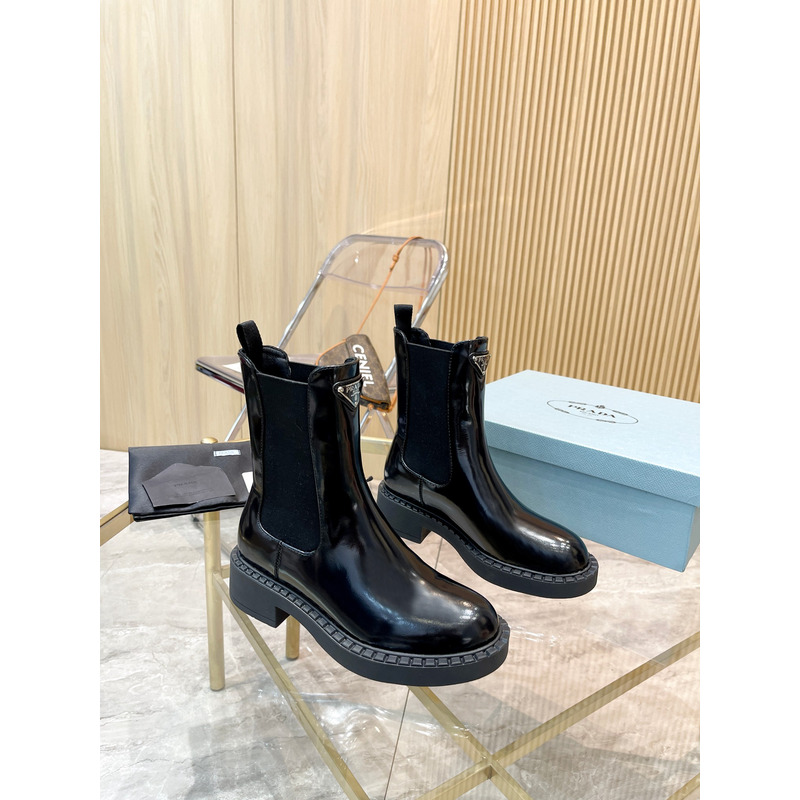 Pra*a metal triangle logo chelsea boots in black