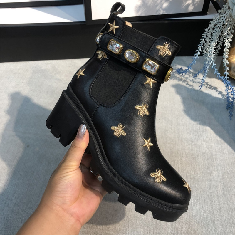 G*u*i embroidered leather ankle boot with belt