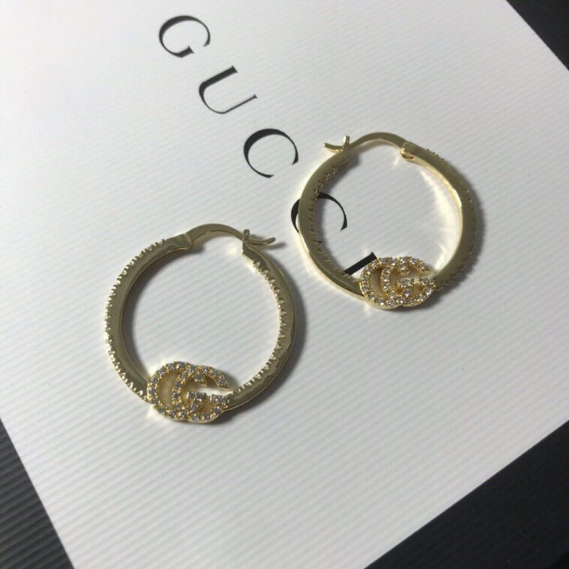 G*u*i earrings