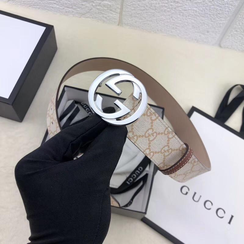 G*u*i belt with silver buckle